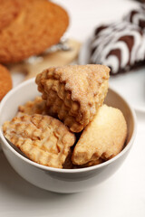 Delicious assorted cookies displayed in a bowl, showcasing their unique shapes and textures for an inviting treat