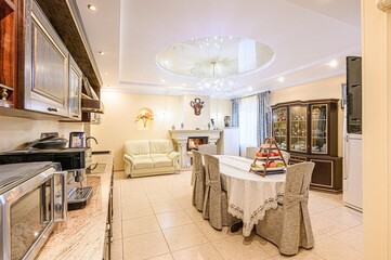 interior apartment kitchen and dining room, refectory area, cooking equipment, table furniture, stove
