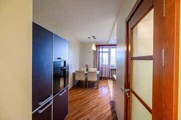 interior apartment kitchen and dining room, refectory area, cooking equipment, table furniture, stove