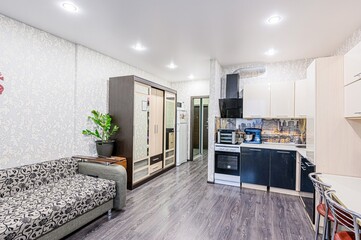 interior apartment kitchen and dining room, refectory area, cooking equipment, table furniture, stove