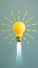 Business startup, creative idea, inspiration, education knowledge and learning, innovation concept. Yellow lightbulb as spaceship or rocket launch with fire smoke graphic on light green background.
