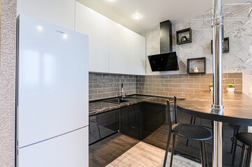 interior apartment kitchen and dining room, refectory area, cooking equipment, table furniture, stove