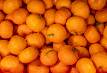 tangerines with green leaves on the market
