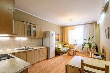 interior apartment kitchen and dining room, refectory area, cooking equipment, table furniture, stove