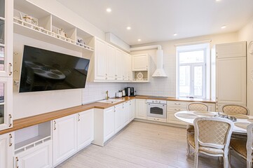 interior apartment kitchen and dining room, refectory area, cooking equipment, table furniture, stove