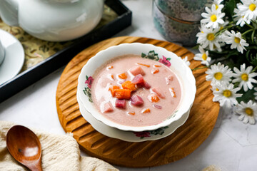 Bubur Cha Cha is a creamy coconut dessert with colorful cubes of purple, orange, and white sweet potatoes and yam. A traditional Southeast Asian dessert, particularly popular in Malaysia and Singapore