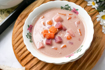 Bubur Cha Cha is a creamy coconut dessert with colorful cubes of purple, orange, and white sweet potatoes and yam. A traditional Southeast Asian dessert, particularly popular in Malaysia and Singapore