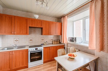 interior apartment kitchen and dining room, refectory area, cooking equipment, table furniture, stove