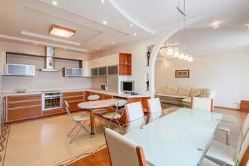 interior apartment kitchen and dining room, refectory area, cooking equipment, table furniture, stove