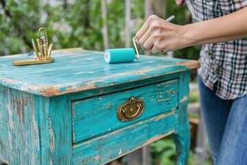 Woman Refinishing Vintage Teal Table
