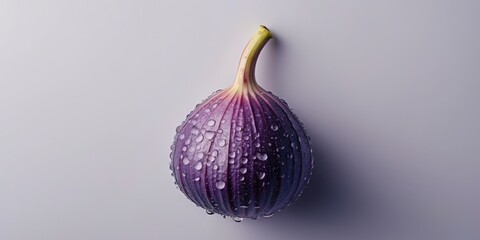 Fototapeta premium Close up of a fresh purple fig with water droplets