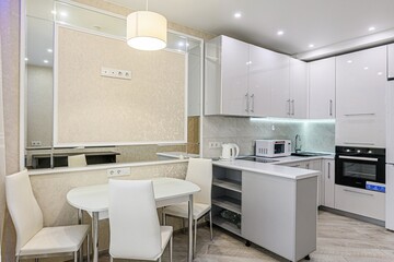 interior apartment kitchen and dining room, refectory area, cooking equipment, table furniture, stove