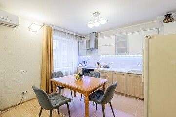 interior apartment kitchen and dining room, refectory area, cooking equipment, table furniture, stove