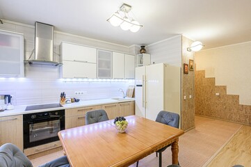 interior apartment kitchen and dining room, refectory area, cooking equipment, table furniture, stove