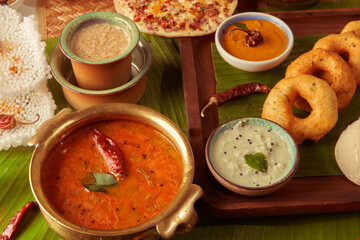 south indian food on the table sambhar, filter coffee with coconut chutney and chillli
