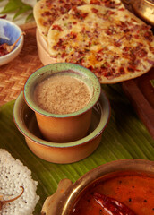 filter coffee with south indian food around it