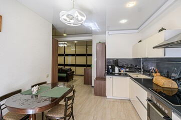 interior apartment kitchen and dining room, refectory area, cooking equipment, table furniture,...