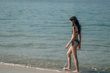 Young woman in walking on seaside