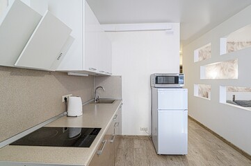 interior apartment kitchen and dining room, refectory area, cooking equipment, table furniture, stove