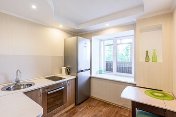interior apartment kitchen and dining room, refectory area, cooking equipment, table furniture, stove