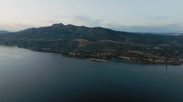 The shipwreck of cruse ship "Mediterranean Sky" in gulf of Elefsina, Greece during sunset.