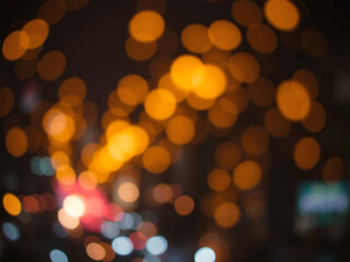 Obraz premium Golden Bokeh Lights in a Night Cityscape with a Warm Glow and Soft Focus. Generative AI