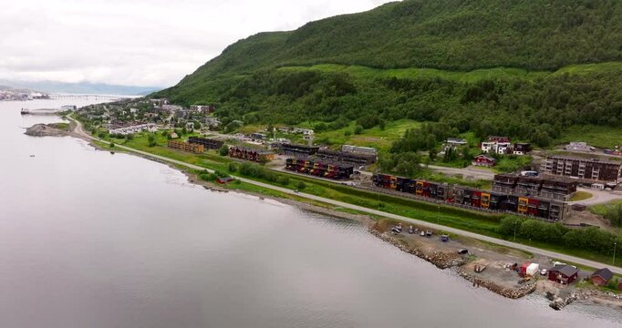 A View Of Modern Home Apartment Along E8 Highway In Tromso, Norway. Aerial Drone Shot