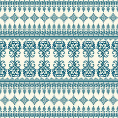 Intricate teal floral and geometric pattern on cream background, featuring symmetrical designs and ornate motifs, perfect for textiles or wallpaper