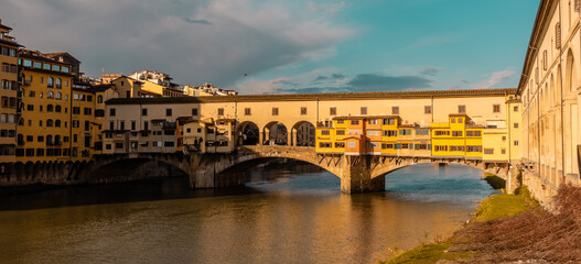 Amazing sunset view of the Old Bridge (Ponte Vecchio in Florence, Italy