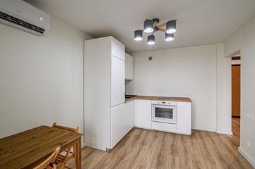 interior apartment kitchen and dining room, refectory area, cooking equipment, table furniture, stove