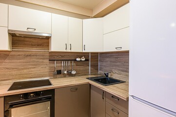 Fototapeta premium interior apartment kitchen and dining room, refectory area, cooking equipment, table furniture, stove