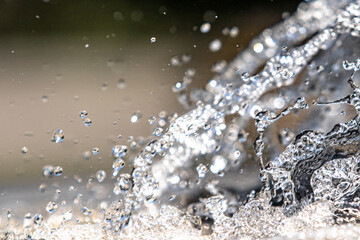 Fountain water splashes, close up, summer nature.