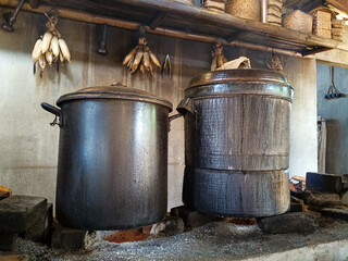 Ancient Cooking Vessels on Rustic Stove