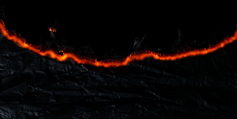 burning paper, glowing edge of paper on a black background