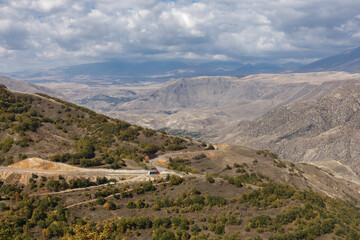 Mountainous landscape of Armenia showcasing rugged terrain and cloudy skies