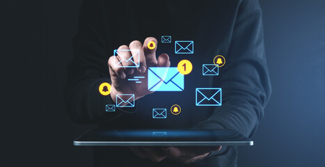 Digital communication concept with glowing email icons and notifications on a dark background.