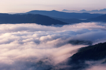 summer foggy scenery, scenic sunset view in the mountains