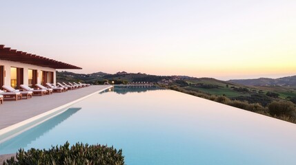 Fototapeta premium Getaway vacation idea. Stunning infinity pool with scenic landscape view during sunset.