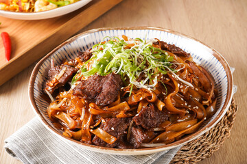 Stir fried Beef River with Swiss Sauce served in bowl isolated on napkin side view of hong kong food on wooden background