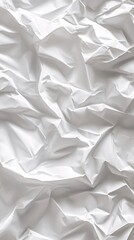 Obraz premium Crumpled white paper texture with subtle shadows and highlights.