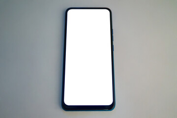 Blank smartphone screen on a plain surface with minimalistic design