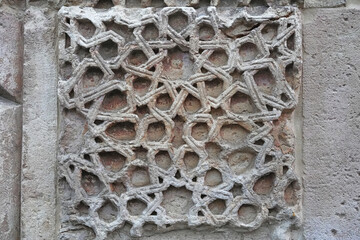 A historical building framed with artistically carved stonework. Architectural detail from the...