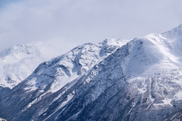 Winter mountain landscape with rocks and snow, Prielbrusye, Kabardino-Balkaria, Russia