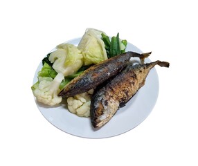 fried fishes with green vegetables