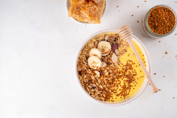 Healthy superfood fruit smoothie bowl with bee pollen
