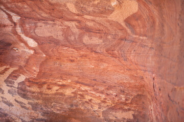Sandstone rock and mineral layers in Petra, Jordan