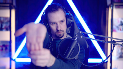 Male gaming streamer hand stretch to get ready to play game