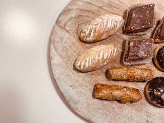 Traditional Arabic Sweets Selection on Wooden Table: A Colorful and Flavorful Feast.