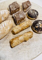 Traditional Arabic Sweets Selection on Wooden Table: A Colorful and Flavorful Feast.