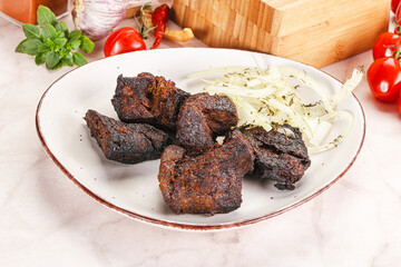 Grilled beef barbecue served onion